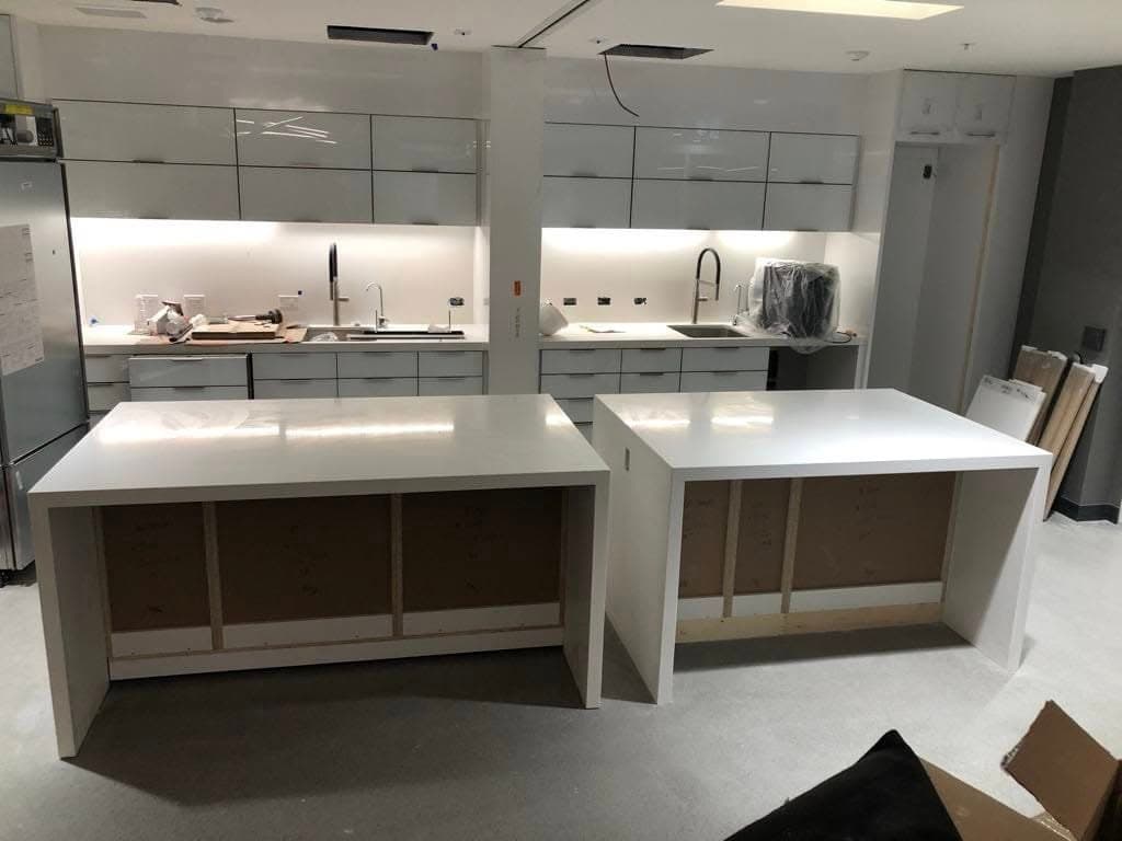 Verde Argento Granite countertop — Office reception desk at 201 Portage, Winnipeg