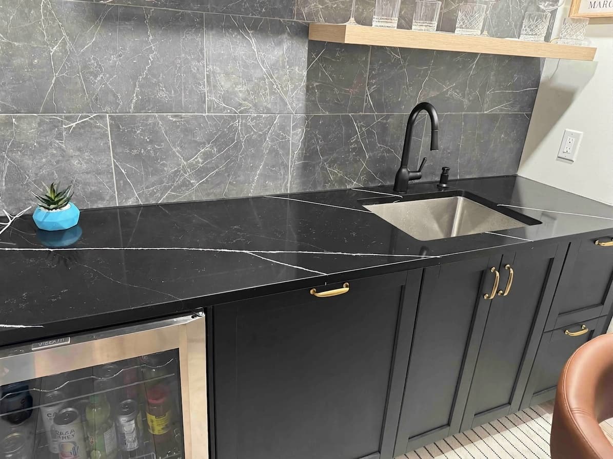 Empira Black Quartz countertop — Lower-level wet bar in Linden Woods, Winnipeg