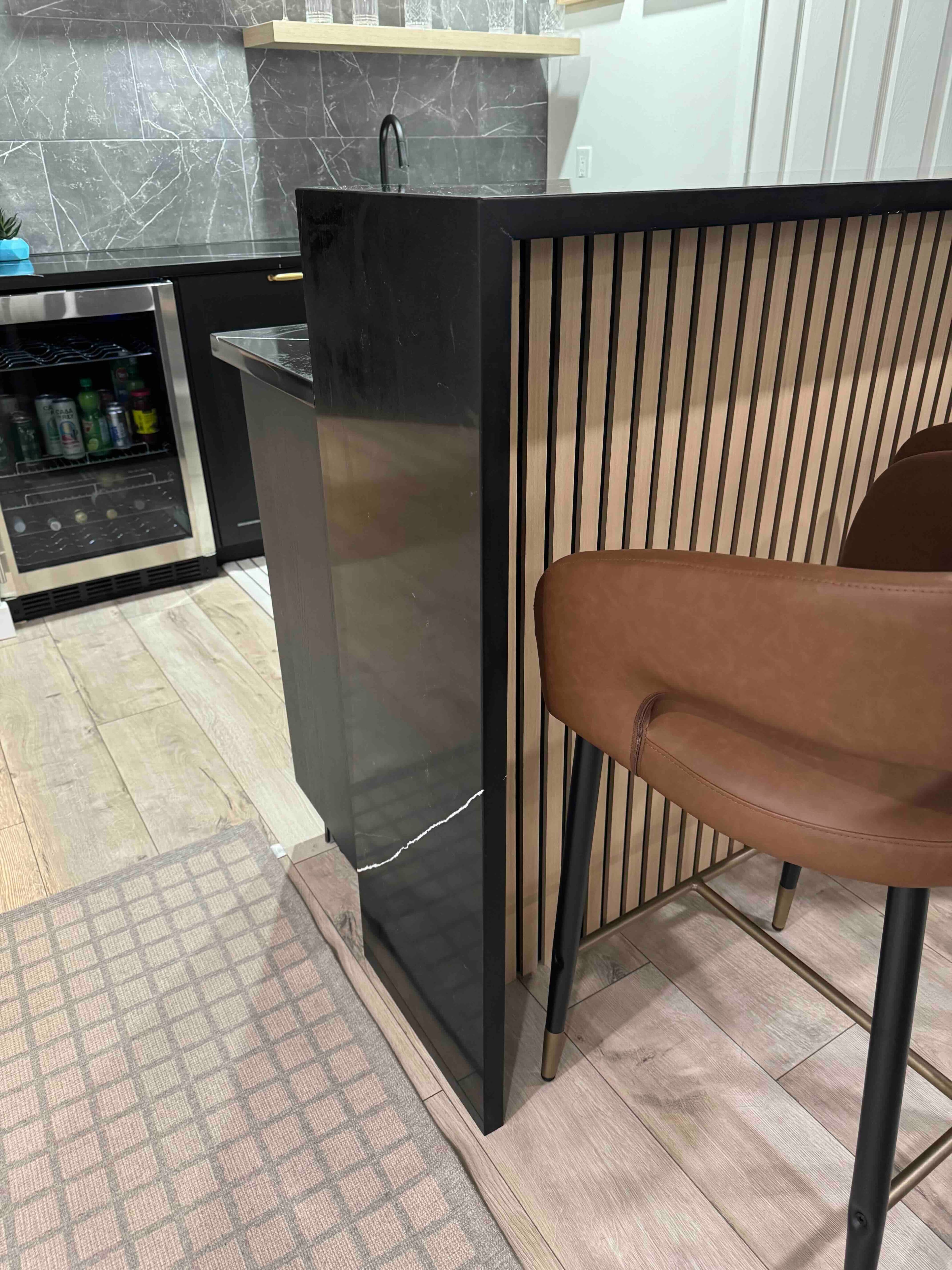 Empira Black Quartz countertop — Lower-level wet bar in Linden Woods, Winnipeg