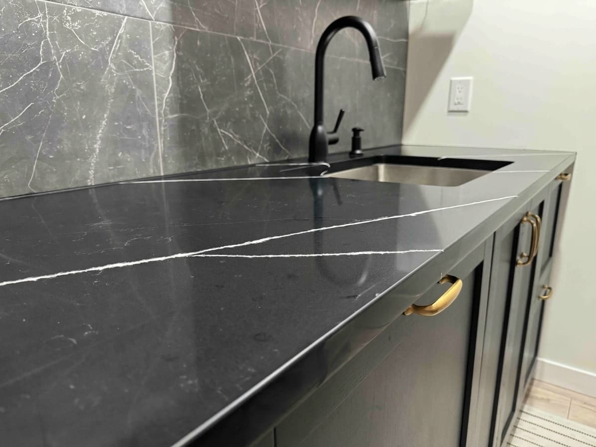 Empira Black Quartz countertop — Lower-level wet bar in Linden Woods, Winnipeg