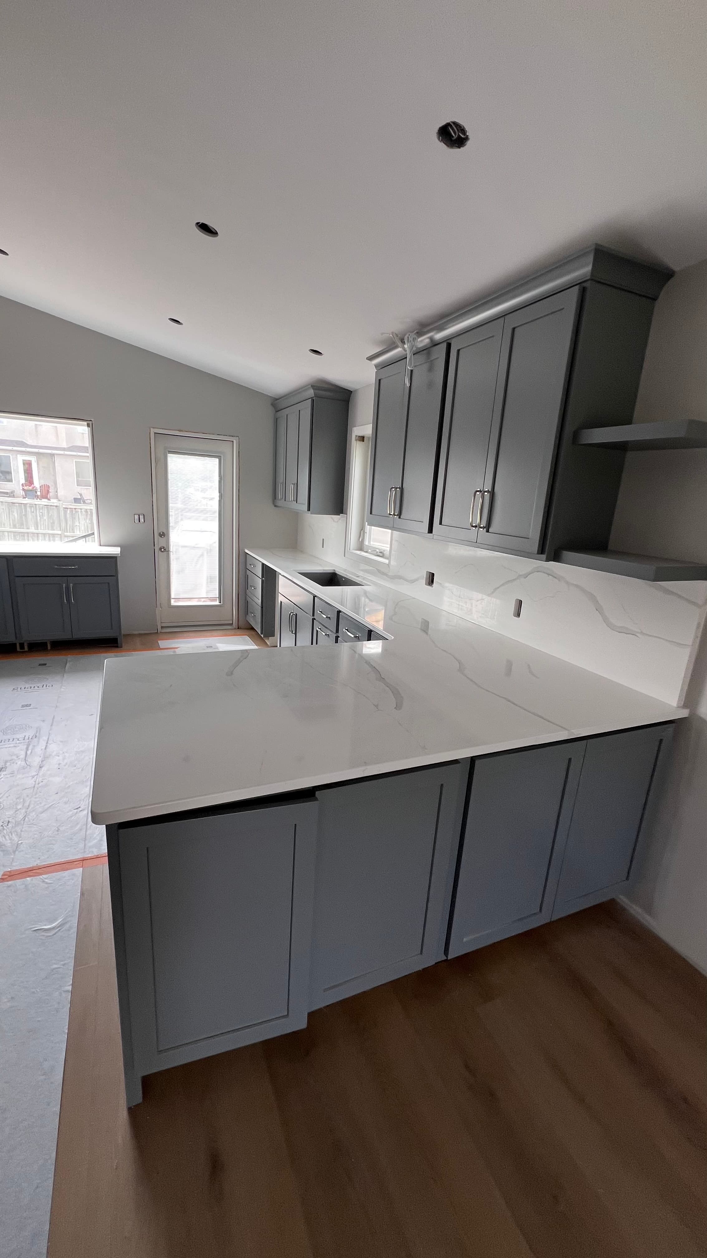 Frosty Carrina Quartz countertop — New build kitchen in Bridgwater Forest, Winnipeg