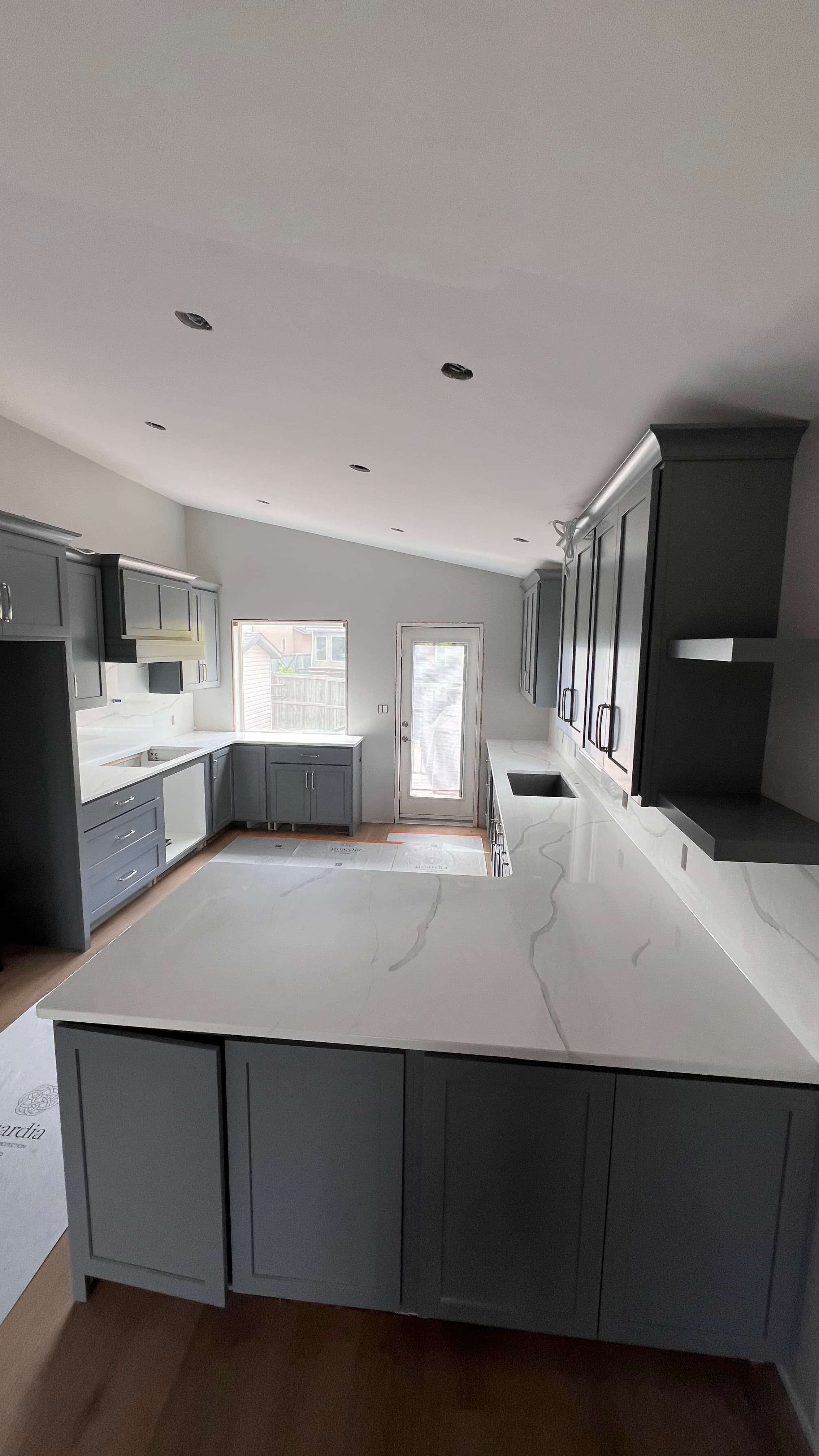 Frosty Carrina Quartz countertop — New build kitchen in Bridgwater Forest, Winnipeg