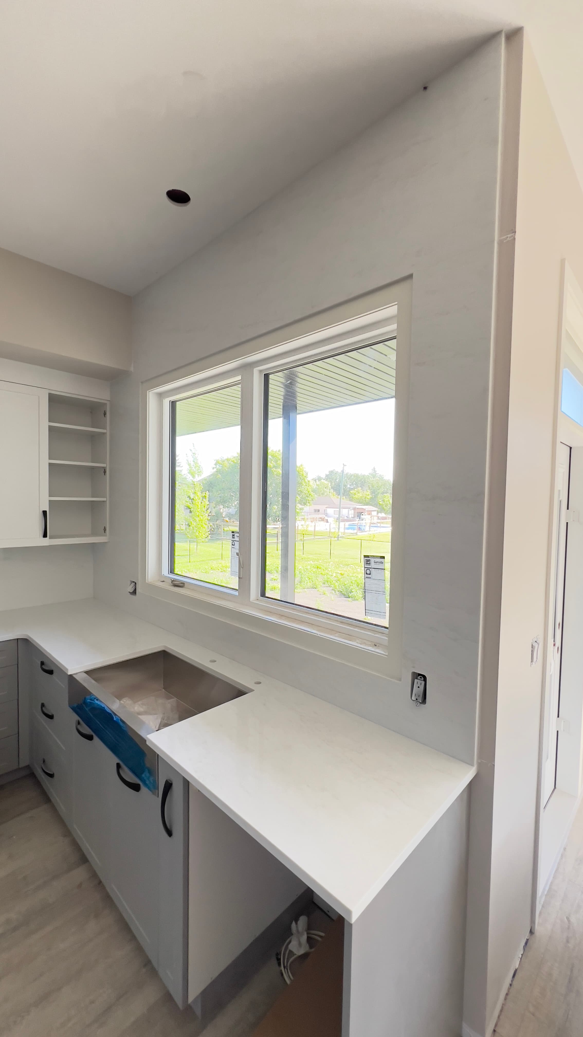 Taj Mahal Quartzite countertop — Open-concept reno in Sage Creek, Winnipeg