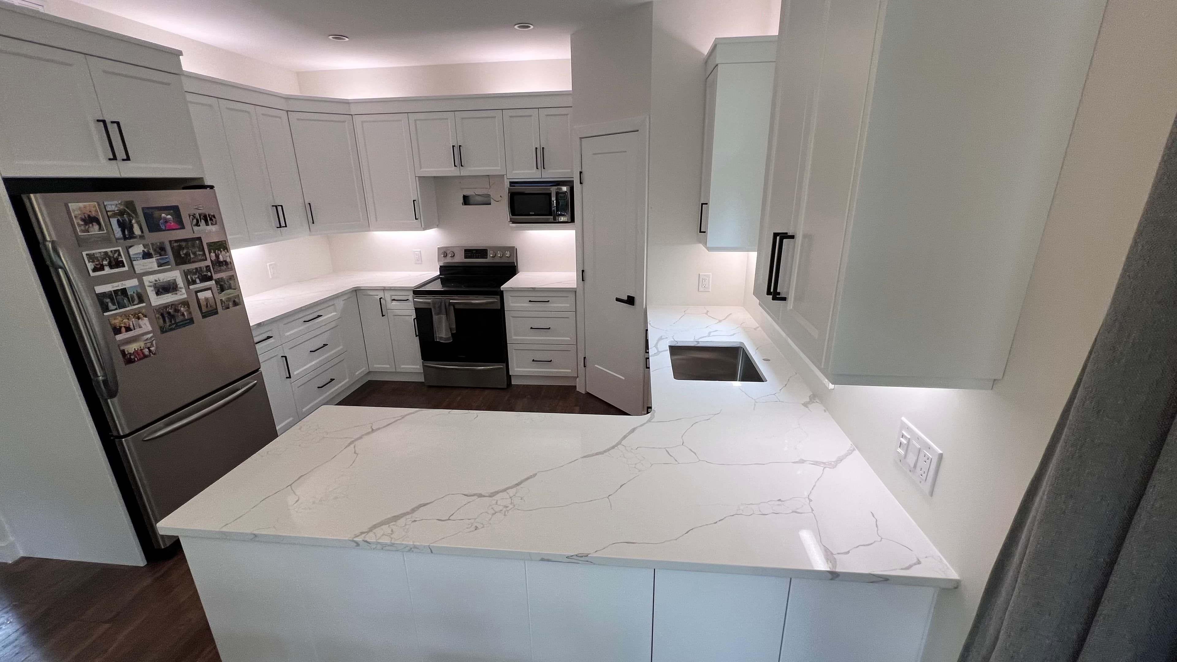 Statuario Quartz countertop — Family bath vanity set in Charleswood, Winnipeg